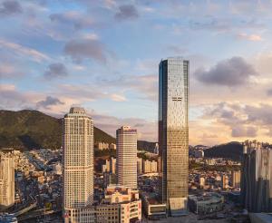 a group of tall buildings in a city at Avani Central Busan in Busan