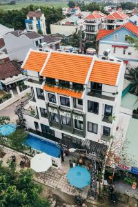 an overhead view of a building with an orange roof at Le Petit Villa Hoi An in Hoi An