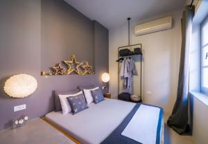 A bed or beds in a room at Sophia Aegina