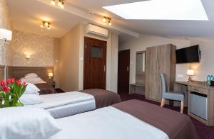 Posteľ alebo postele v izbe v ubytovaní Hotel Maximum