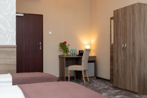 Posteľ alebo postele v izbe v ubytovaní Hotel Maximum