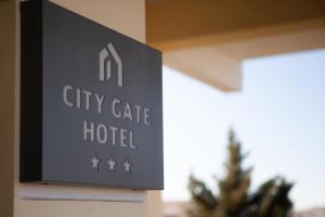 a sign for a city gate hotel on a building at City Gate Hotel Airport Thessaloniki in Thessaloniki