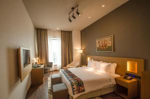 Ένα ή περισσότερα κρεβάτια σε δωμάτιο στο AltAir Boutique Hotel