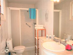 a bathroom with a toilet and a sink and a shower at APARTAMENTO ISAMAR in Calella +27 photos