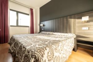 Postel nebo postele na pokoji v ubytování Hotel Abades Via Norte