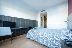 Postel nebo postele na pokoji v ubytování Hotel Abades Via Norte