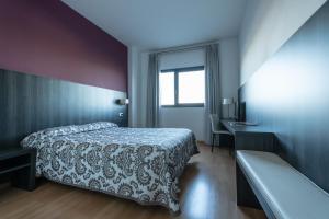 Postel nebo postele na pokoji v ubytování Hotel Abades Via Norte