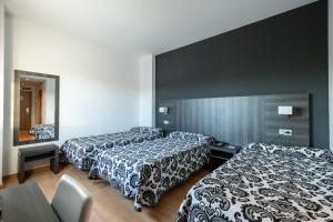 Postel nebo postele na pokoji v ubytování Hotel Abades Via Norte
