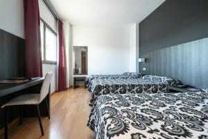 Postel nebo postele na pokoji v ubytování Hotel Abades Via Norte