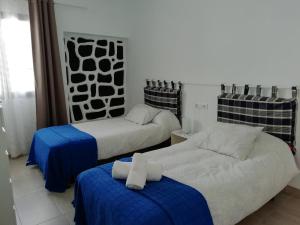 Posteľ alebo postele v izbe v ubytovaní Casa Gloria