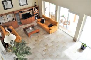 an overhead view of a living room with couches and a tv at SA ROTA Finca en Bunyola 8 personas- Muy tranquilo in Bunyola