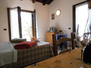 Postel nebo postele na pokoji v ubytování Agriturismo la Casetta