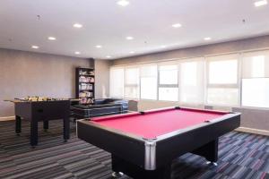 a billiard room with a pool table and two tables at Suria Jelutong Studio by BeeStay in Shah Alam
