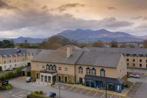 an aerial view of a building with mountains in the background at The Parkavon Hotel in Killarney