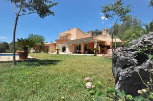 a house with a yard in front of it at SA ROTA Finca en Bunyola 8 personas- Muy tranquilo in Bunyola