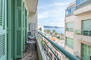 a balcony with a view of the ocean at La Suite 111 in Nice