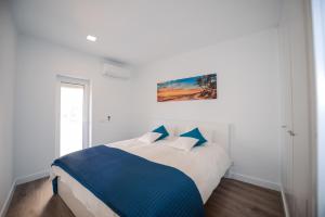 Postel nebo postele na pokoji v ubytování SEAFRONT LUZ APARTMENT