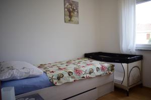Ein Bett oder Betten in einem Zimmer der Unterkunft Apartment Eve