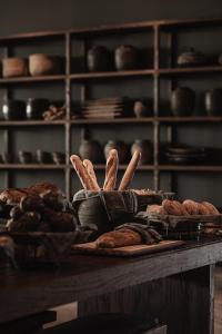 a table with some bread and pastries on it at OKU Ibiza in San Antonio