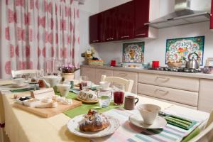 a kitchen with a table with food on it at B&B Panorama in Piazza Armerina