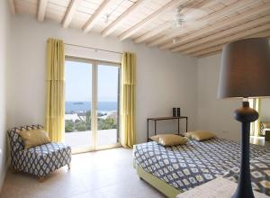 a bedroom with a bed and a large window at ABSOLUTE PARADISE in Paradise Beach +85 photos