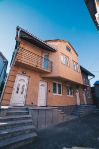a brick building with stairs in front of it at Boutique Luxury Apartments in Kragujevac