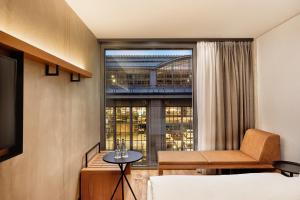 Postel nebo postele na pokoji v ubytování H2 Hotel Leipzig