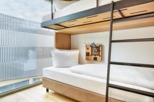 Postel nebo postele na pokoji v ubytování H2 Hotel Leipzig