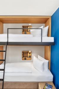 Postel nebo postele na pokoji v ubytování H2 Hotel Leipzig