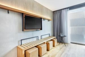 TV a/nebo společenská místnost v ubytování H2 Hotel Leipzig