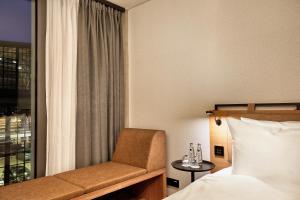 Postel nebo postele na pokoji v ubytování H2 Hotel Leipzig