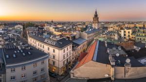 an aerial view of a city at sunset at Apartments Roman in Krakow