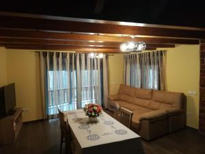 a living room with a couch and a table at Casa Rural Rio Cabrera in Las Médulas