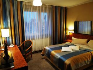 Postel nebo postele na pokoji v ubytování Hotel Passione