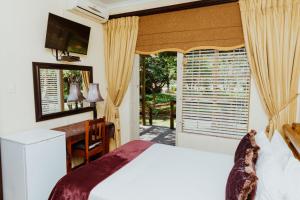 เตียงในห้องที่ Boubou Bed and Breakfast