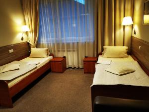Postel nebo postele na pokoji v ubytování Hotel Passione