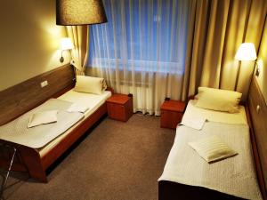 Postel nebo postele na pokoji v ubytování Hotel Passione