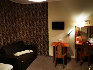 A television and/or entertainment centre at Hotel Passione