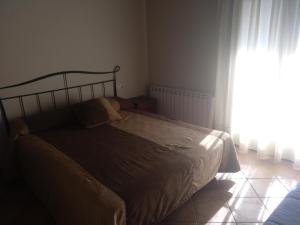 Posteľ alebo postele v izbe v ubytovaní Nadal Apartaments