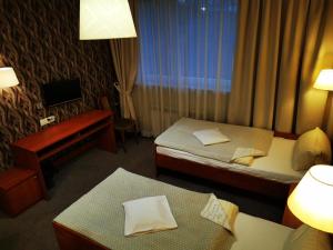 Postel nebo postele na pokoji v ubytování Hotel Passione