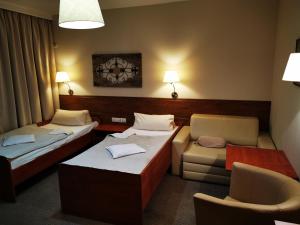 Postel nebo postele na pokoji v ubytování Hotel Passione