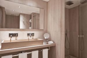 a bathroom with a sink and a shower at The Margi in Athens