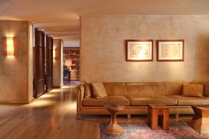 a living room with a couch and a table at The Margi in Athens
