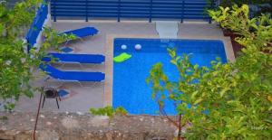 an overhead view of a swimming pool in a backyard at Maria Studios in Agia Effimia