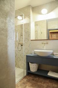 a bathroom with a sink and a shower at Pension Angusfarm in Soběsuky