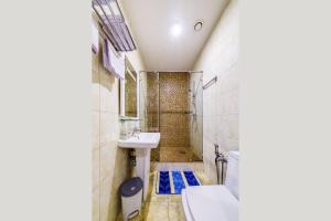 a bathroom with a sink and a toilet at Hotel Elite in Moscow