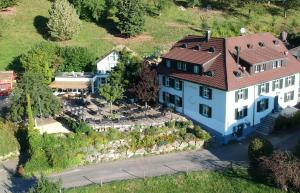 an aerial view of a large white house with a red roof at Landgasthof Farnsburg in Ormalingen