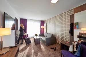 TV a/nebo společenská místnost v ubytování Hotel Mühlenhof Lollar