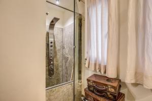 a bathroom with a shower and a wooden stool at Argileto Terra in Rome +67 photos