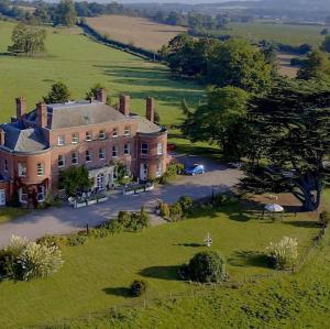 an aerial view of a large house in a field at Longworth Hall Hotel in Hereford